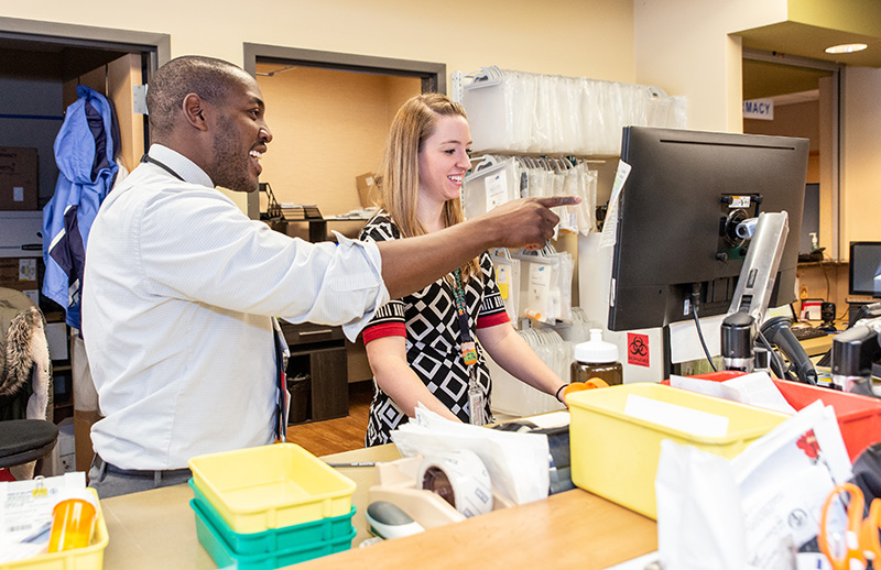 Two SOP students at work on rotation at House of Wellness in Baraboo